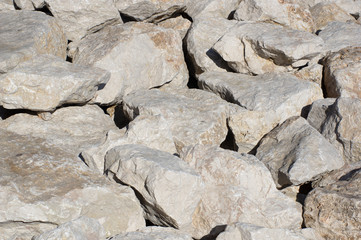Pile of stones on the seashore protection against waves