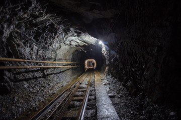 Naklejka premium Gold mine ore shaft tunnel with rails