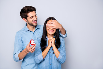 Photo of two people together white wearing jeans denim with girlfriend anticipating eyes covered and loving boyfriend getting ready to propose to her isolated grey color background