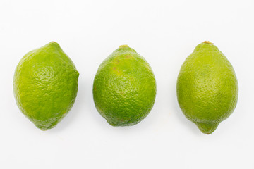 three fresh limes isolated on white background