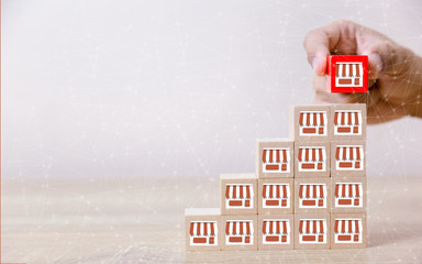 Franchise business concep,hand choose wood blog with franchise marketing.