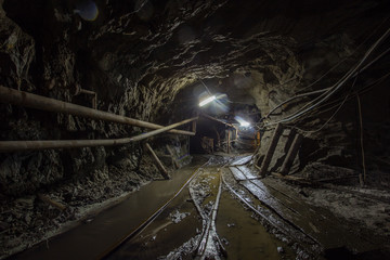 Gold mine ore shaft tunnel with rails