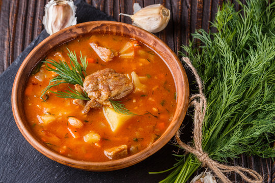 Chanahi a traditional Georgian meat stew in a bowl on stoyn board