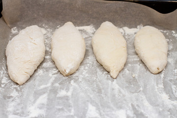 pies on baking paper in flour