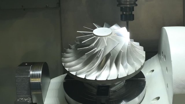 CNC milling machine work. Five axis impeller machining in metalwork industry