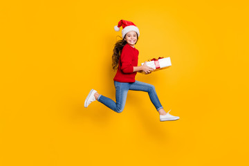 Full size profile photo of crazy little lady jumping high taking giftbox from santa in x-mas...
