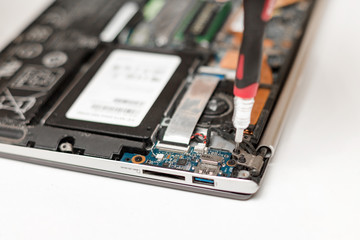 Repair broken on laptop hinges. Repair laptop in the workshop