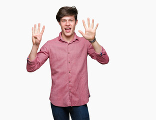 Young handsome business man over isolated background showing and pointing up with fingers number...