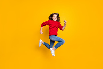 Fototapeta na wymiar Full size photo of positive cheerful funky kid jump run after winter seasonal discounts wear stylish outfit white sneaker isolated over yellow color background