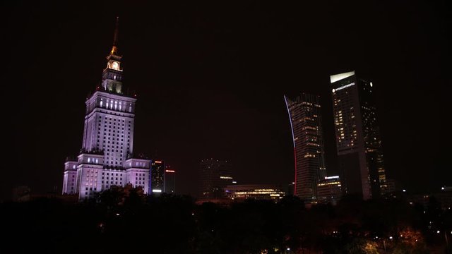 Poland, Warsaw, Palace of culture and science, night city is illuminated,
