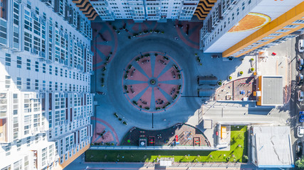 Public square tiled using organic design. Modern residential building complex, in Odessa close to the Central Train Station, Ukraine, August 2019. © cubrick