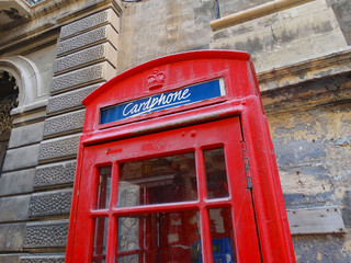 Fototapeta premium Red telephone cabin in La Valletta street, Malta