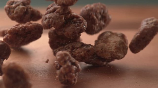 Pralines falling onto wooden surface in super slow motion.  Shot on Phantom Flex 4K high speed camera. 
