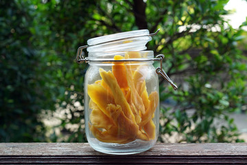 Dehydrated Mango or Dried Mango slices on wooden table         