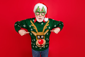 Photo of santa looking on unbelievable low x-mas shopping prices indicate fingers on cheap jumper...