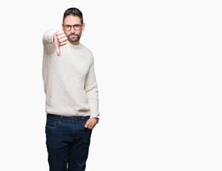 Fototapeta premium Young handsome man wearing glasses over isolated background looking unhappy and angry showing rejection and negative with thumbs down gesture. Bad expression.