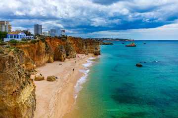 Obraz premium Praia dos Tres Castelos in south Portugal, Portimao, Algarve region. Landscape with Atlantic Ocean, shore and rocks in Tres Castelos beach (Praia dos Tres Castelos), Algarve, Portimao, Portugal.
