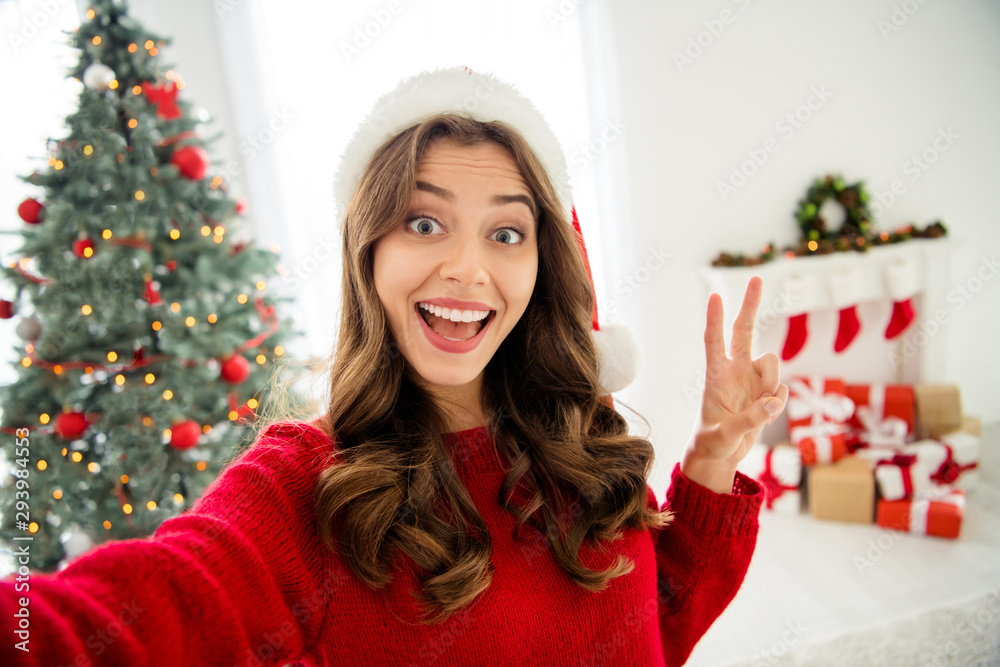 Sticker Self portrait of beautiful attractive charming cute pretty nice girlfriend showing you v-sign while photographing before shining garland and gift boxes