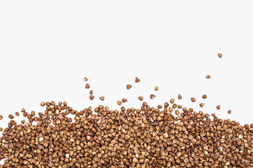 background of buckwheat grains on a white table