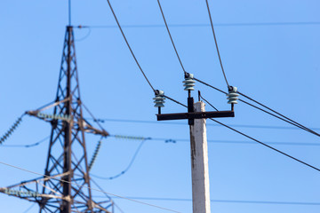 Electric pole against the blue sky