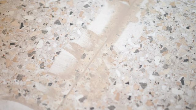 Repair and decoration of apartments and houses. woman fugues seams tiles in the bathroom