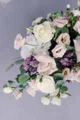 Beautiful fresh flowers on the wedding table. Stylish floristics at a classic wedding