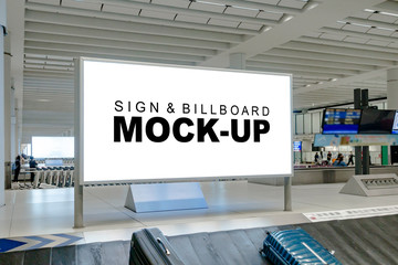 Mock up large blank horizontal billboard at baggage claim point