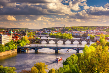 Fototapeta na wymiar Scenic view on Vltava river and historical center of Prague, buildings and landmarks of old town, Prague, Czech Republic. Charles Bridge (Karluv Most) and Lesser Town Tower, Prague, Czechia