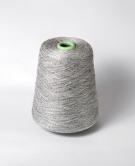 bobbin of yarn on a white background. Side view.Textile reel on isolated white background.