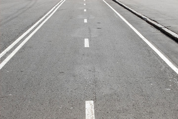 An empty road with white road marking