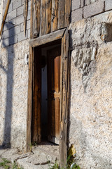 old wooden door in a stone wall