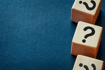 Side border of question marks on wooden cubes