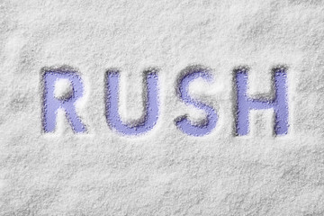 Rush letters on a sugar background viewed from above. Sugar rush concept. Top view