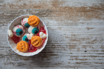 Halloween sweets on wooden surface
