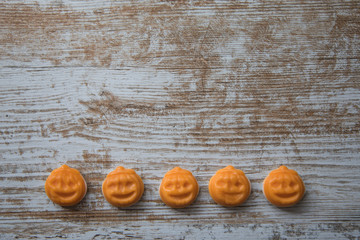 Halloween pumpkins on wooden surface