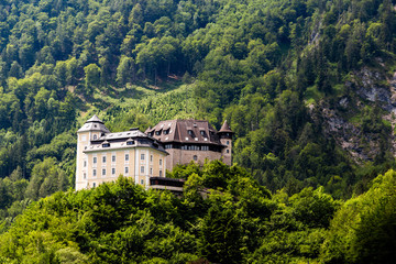 Fototapeta na wymiar Castle Klaus on the blue lake in Austrian Alps. Summer day.