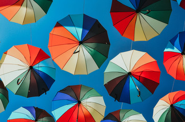 Rainbow Umbrellas in a blue sky