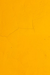 Orange textured wall with crack