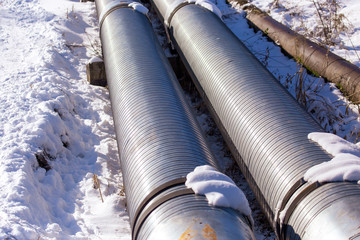 Large pipes in the snow in winter