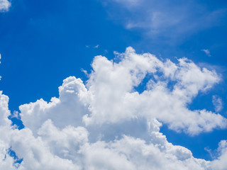 Naklejka na ściany i meble Blue sky and wispy white clouds at a sunny day