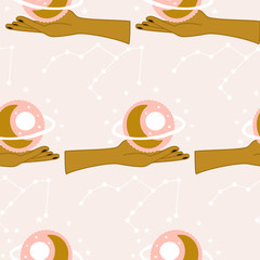 Hands and celestial elements in a seamless pattern design