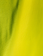 Obraz premium Yellow silk fabric as an abstract background