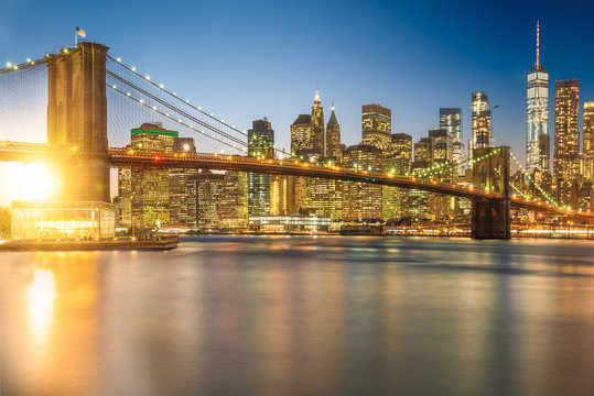 a magnificent view of the lower Manhattan and Brooklyn Bridge with sunset, New York City © maramas