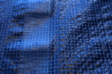 Construction work on old brick house with scaffolding, tarps, cement etc