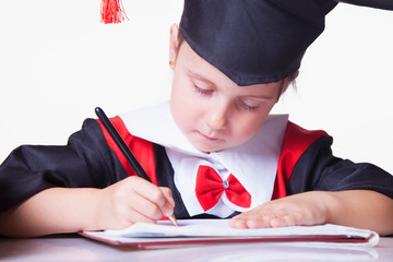 Child girl college graduate signing an employment contract. Humorous photo. (Knowledge, studies,...