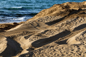footprints in the sand on the shores of the Mediterranean Sea in the north of Israel