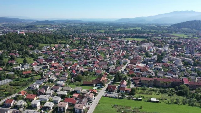 Picturesque autumn landscape of Ljubljana Marshes overlooking brownish roofs of houses of small Slovenian town of Vrhnika