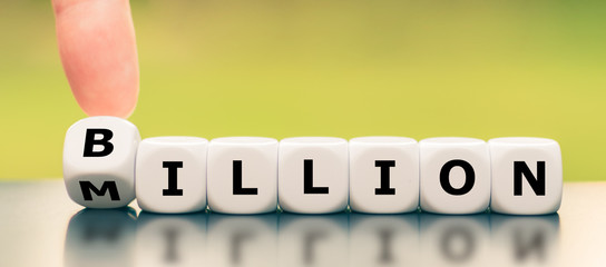 Hand turns a dice and changes the word 
