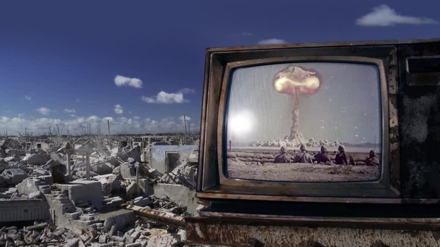 Nuclear Bomb Test on a Retro TV over a Background of a Demolished City. Public Domain Footage. 