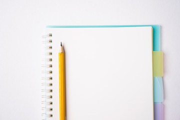 Blank notebook on white table, copy space for text